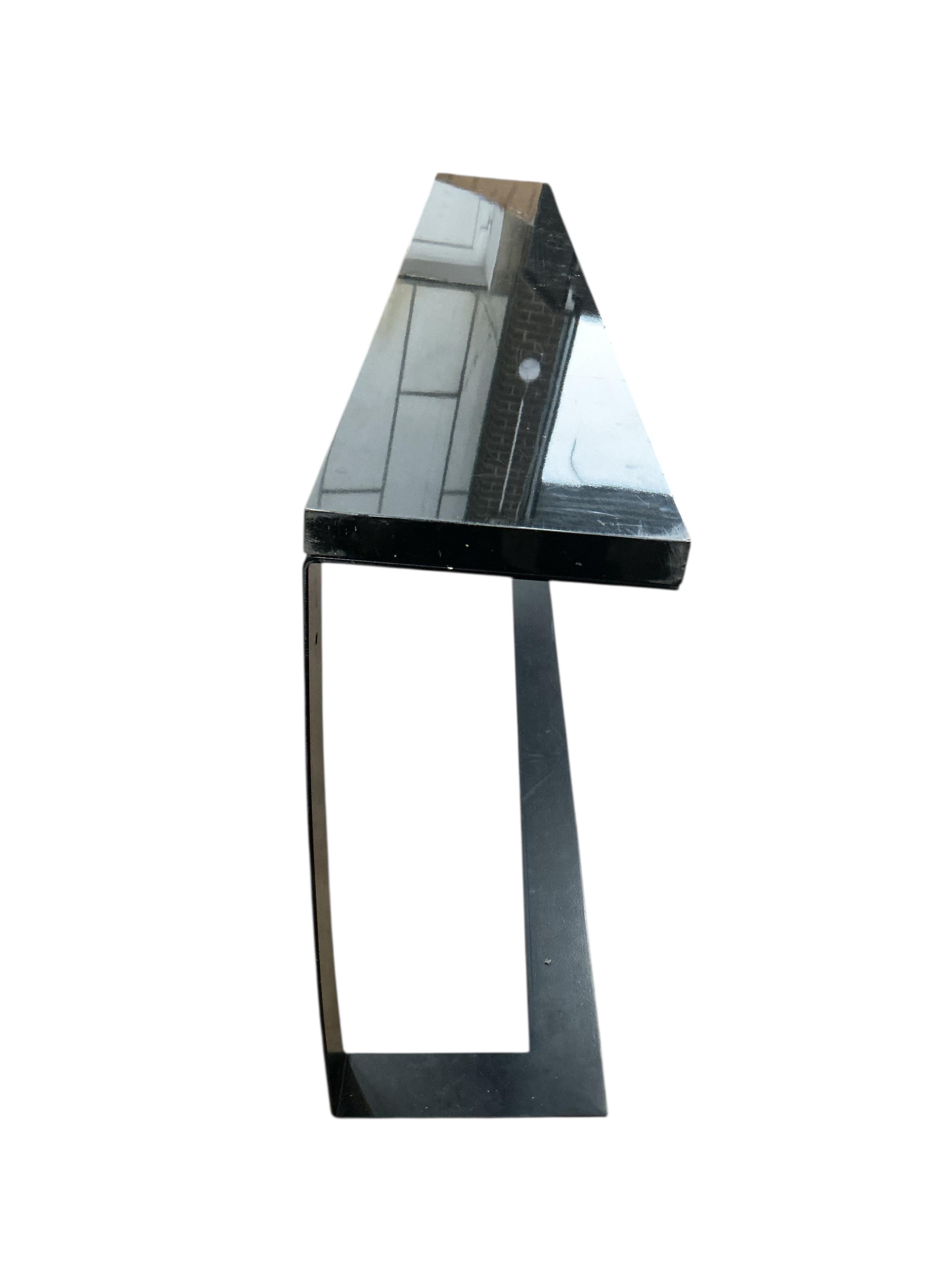 A Contemporary ebonised and black coated metal console table, width 240cm, depth 32cm, height 76cm